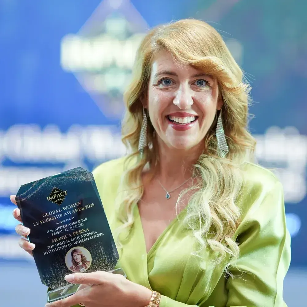 Monica Perna holding the Global Women Leadership Award 2025